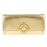 VERSUS BY VERSACE - a gold leather clutch.