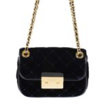 MICHAEL KORS - a velvet quilted Sloan Editor handbag.