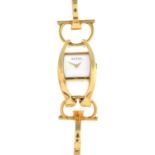 GUCCI - an 18ct gold 'Horsebit' wristwatch.
