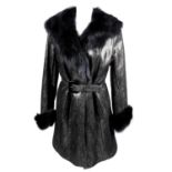 YVES SAINT LAURENT - a fur lined, knee-length coat.