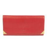 YVES SAINT LAURENT - a red Continental wallet.