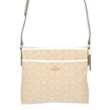 COACH - a Signature File crossbody handbag.