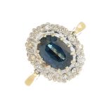 An 18ct gold sapphire and diamond cluster ring.Sapphire calculated weight 1.30cts,