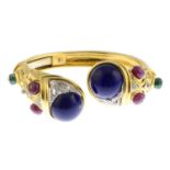 A bangle, set with diamonds lapis-lazuli,
