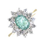 A 9ct gold emerald and diamond cluster ring.Emerald calculated weight 0.45ct,