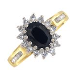 An 18ct gold sapphire and diamond cluster ring.Sapphire calculated weight 0.92ct,