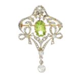 An early 20th century diamond and peridot brooch.Estimated total old-cut diamond weight 0.40ct,