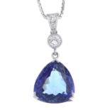 A tanzanite and diamond pendant, suspended from an 18ct gold box-link chain.