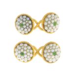 A pair of split pearl and tsavorite garnet cufflinks.