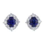 A pair of sapphire and diamond cluster earrings.Sapphire weight 0.83ct,