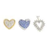 Three diamond and sapphire heart pendants.Estimated total diamond weight 0.75ct.Two with hallmarks