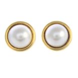 A pair of 18ct gold mabe pearl earrings.Hallmarks for Sheffield.Diameter 1.7cms.