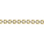 An 18ct gold bi-colour brick-link bracelet.Italian marks.Length 19cms.