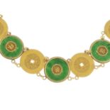 A jade bracelet, with partially concealed push-piece clasp.Stamped WH 20.Length 18cms.