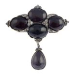 A brooch, set with garnets and diamonds.Length 5.6cms.