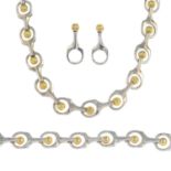 A set of 18ct gold and silver jewellery.Hallmarks for Sheffield, 2001.Length of necklace 50cms.