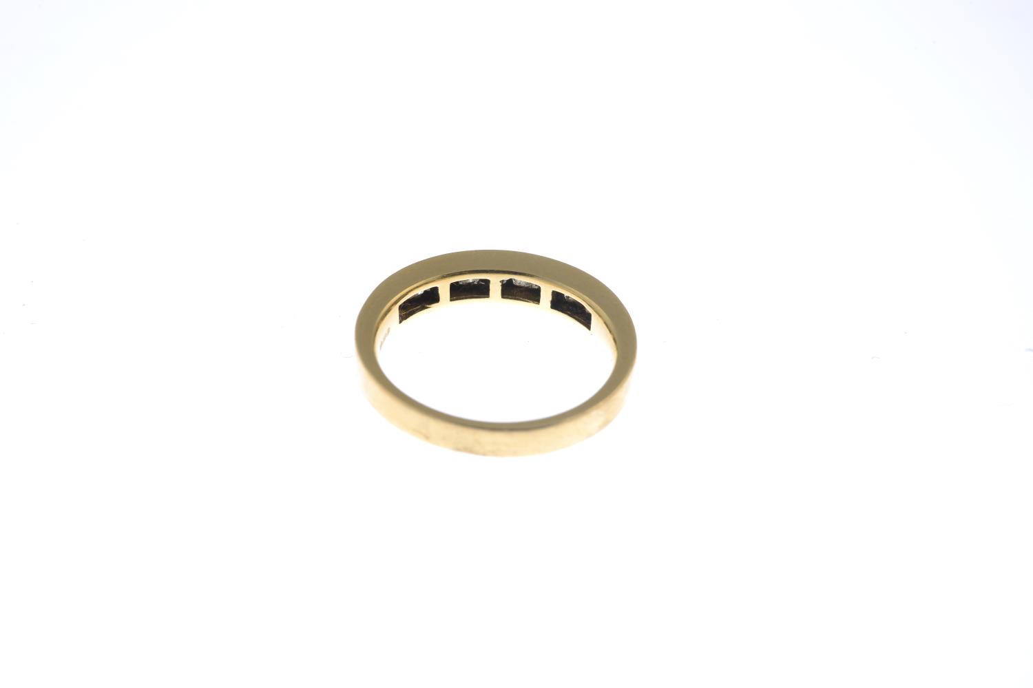 An 18ct gold diamond half eternity ring.Total diamond weight 0.70ct, stamped to band. - Image 3 of 3