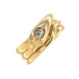 A late Victorian 18ct gold diamond snake ring.Stamped 15ct.Ring size P.