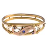 An early 20th century 9ct gold sapphire and diamond bangle.Hallmarks for Chester,1913.