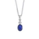 A sapphire and diamond pendant, suspended from an 18ct gold chain.