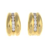 A pair of 18ct gold diamond earrings.