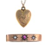 An early 20th century 9ct gold engraved heart pendant,