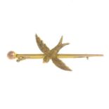 An early 20th century 9ct gold swallow bar brooch,