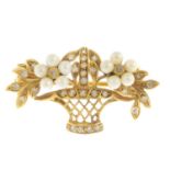 A diamond and seed pearl flower basket brooch.