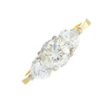 An 18ct gold diamond three-stone ring.Estimated total diamond weight 1.50cts,