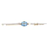 An early 20th century 18ct gold and platinum topaz brooch.Stamped 18ct and PLAT.