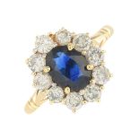 An 14ct gold sapphire and diamond cluster ring.Sapphire calculated weight 1ct,