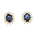 A pair of sapphire and diamond cluster earrings.Estimated total diamond weight 0.55ct.Length