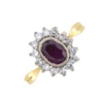 An 18ct gold ruby and diamond cluster ring.Ruby calculated weight 0.56ct,