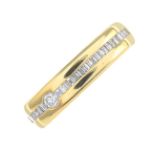 A vari-cut diamond band ring.Estimated total diamond weight 0.40ct.Stamped 750.Ring size T1/2.