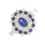 An 18ct gold sapphire and diamond cluster ring.Estimated total diamond weight 0.25ct.