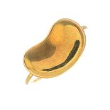 A 'Bean' ring, by Tiffany & Co.Signed Tiffany & Co., Peretti.Stamped 750.Ring size I1/2.