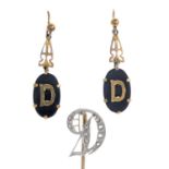 A pair of onyx 'D' initial motif earrings,