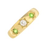 A demantoid garnet and diamond three-stone ring.