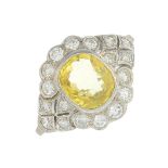 A yellow sapphire and diamond dress ring.Sapphire calculated weight 1.50cts,