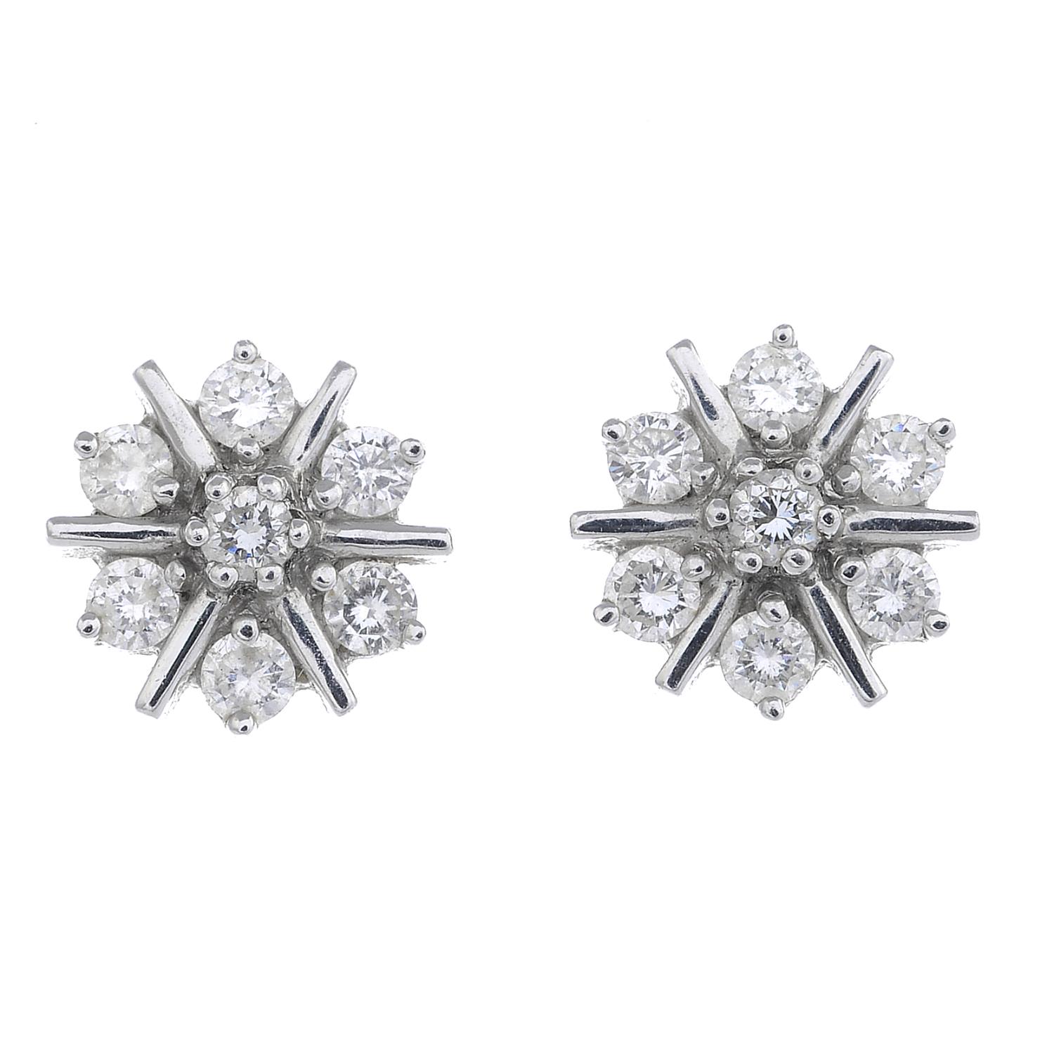 A pair of diamond cluster earrings.Estimated total diamond weight 1ct.Stamped 750.