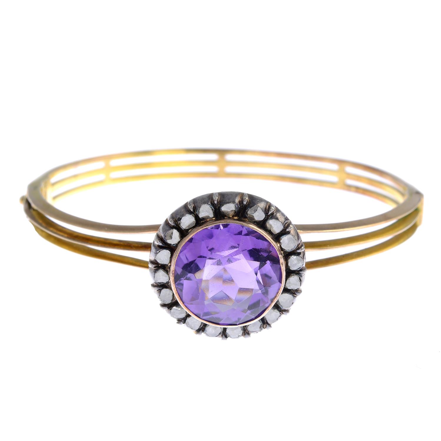 A late 19th century silver and gold amethyst and diamond bangle.Amethyst calculated weight