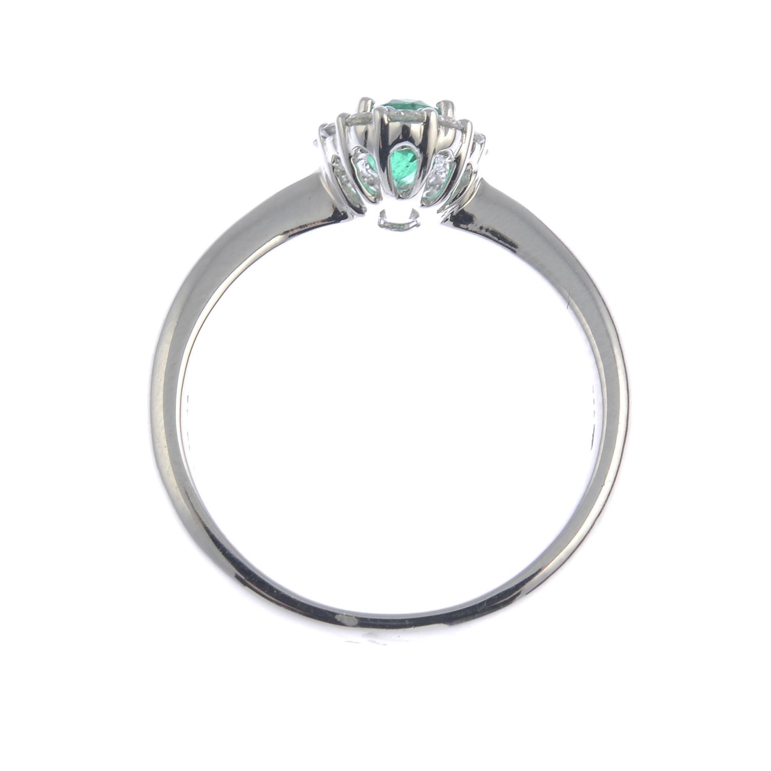 An emerald and diamond cluster ring.Emerald weight 0.43ct, - Image 2 of 3
