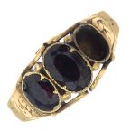 A late 19th century gold garnet three-stone ring.