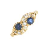 A sapphire and diamond dress ring.Total sapphire weight 0.46ct.