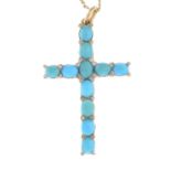 A turquoise and diamond cross pendant, suspended from a fancy-link chain.