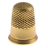 A late Victorian gold thimble, engraved '1888'.Length 2.1cms.