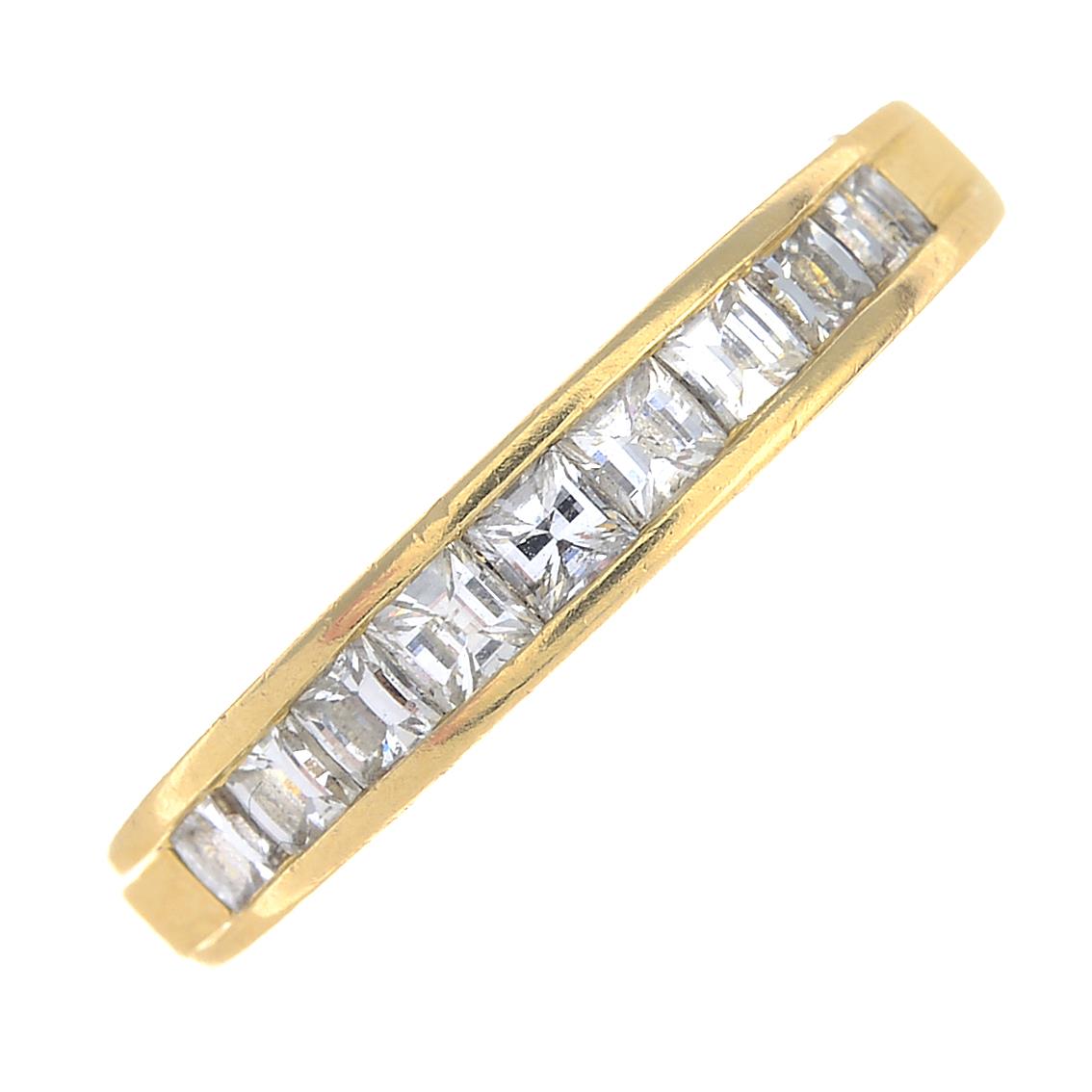 An 18ct gold diamond half eternity ring.Total diamond weight 0.70ct, stamped to band.