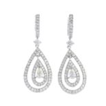 A pair of diamond drop earrings.