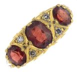 An 18ct gold garnet and diamond ring.Hallmarks for Birmingham, 1976.Ring size J.