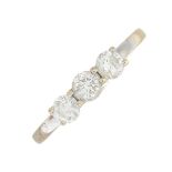 An 18ct gold brilliant-cut diamond three-stone ring.